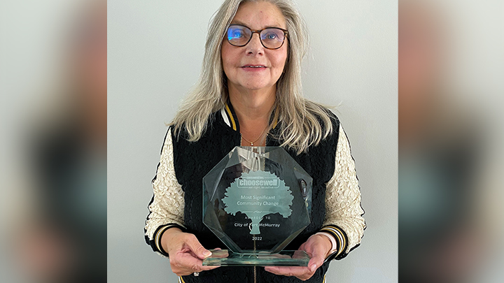 Carolyn Evancio, an AHS health promotion facilitator, holds the 2022 Most Significant Change Award presented as part of Alberta Parks and Recreation’s ChooseWell Healthy Community Awards. It was given to AHS and its community partners in Fort McMurray for their collaborative efforts in promoting active living and wellness by offering seniors access to an adaptive e-bike.