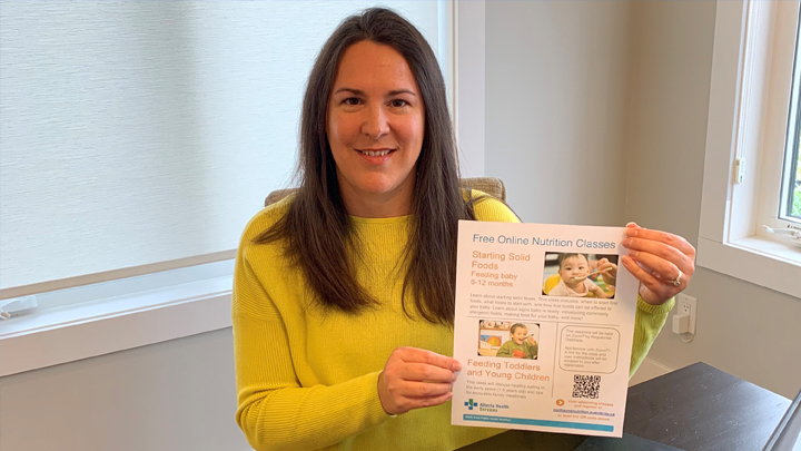 Jillyan Jay, a Registered Dietitian with North Zone Nutrition Services, holds a poster on two nutrition classes: Starting Solid Foods – Feeding your Baby (6-12 months) and Feeding Toddlers and Young Children – Tips for enjoyable mealtimes. The classes are held monthly for clients across the North Zone.