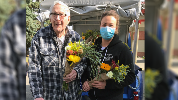 Mackenzie Place resident Cliff Sydbo chose a bouquet for himself and another for his wife from the Gypsy Blooms Flower Truck with the help of rehab therapist Drew Finnson in Grande Prairie. DRL Mechanical sponsored the flower truck’s visit to the long-term care facility to provide bouquets for all of the residents, while Maxwell Mariano of Lyons Production sponsored vases for each resident’s bouquet.