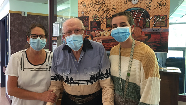 Registered nurse Angela Bownes, left, Galahad Care Centre resident Doug Bush, and recreation therapist Alana Kuefler say they appreciate the new energy-efficient lighting at the centre.