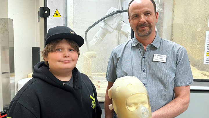 Andreas Donauer, orthotist at the Glenrose Rehabilitation Hospital, shows off the new seven-axis robotic carver that was used to make a foam replica of Rowan McNair’s head.