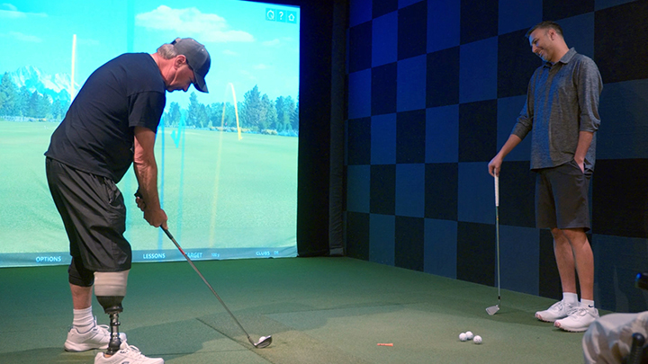 A new indoor golf clinic through the Glenrose Rehabilitation Hospital’s Adult Specialized Rehabilitation Outpatient Program allows patients like Randy Cameron have his swing assessed by golf pro Alan Gallyer in a virtual simulator.