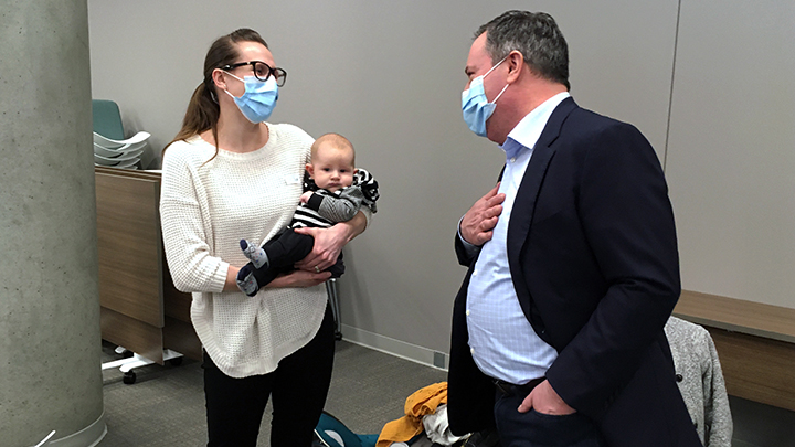 Premier Jason Kenney chats with Mary Wiebe and her baby Ezekiel, the first to be born at the new Grande Prairie Regional Hospital.