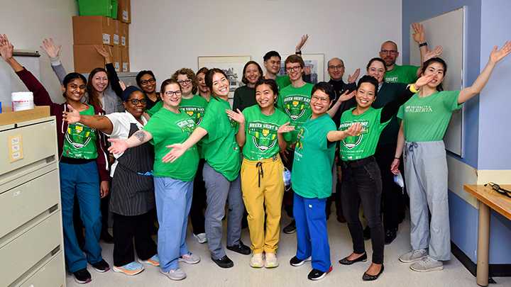 The University of Alberta Hospital’s transplant inpatient unit staff pose for Green Shirt Day in Edmonton