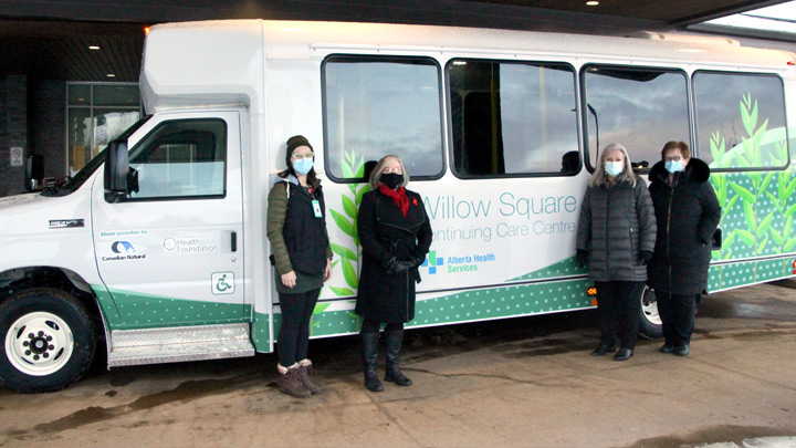 Striking a pose with the new handibus at Willow Square Continuing Care are, from left: Tiffany Sceviour,  AHS recreation therapist; Cindy Amerongen, executive director, Northern Lights Health Foundation; Adele Thomson, land manager, Canadian Natural; and Darline Reid, manager, AHS Seniors Health, Fort McMurray.