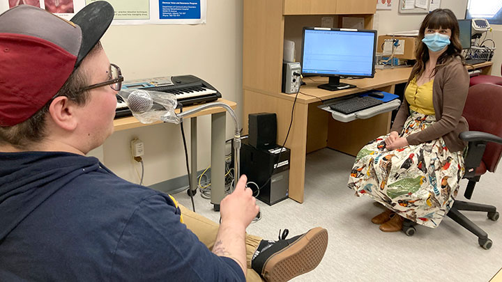 Speech language pathologist Teresa Hardy guides Parker Pothier,  a non-binary transgender person who uses they/them pronouns, through voice exercises, helping to create a voice that matches how they see themself. While keeping a two-metre distance, Parker was allowed to be unmasked during the session so his pathologist could watch the shape of their mouth as they spoke.