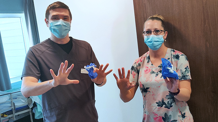 Health care aide trainee Shannon Papirny, right, receives hands-on instruction from clinical nurse educator Cody Houle at Pine Valley Lodge in Hinton.