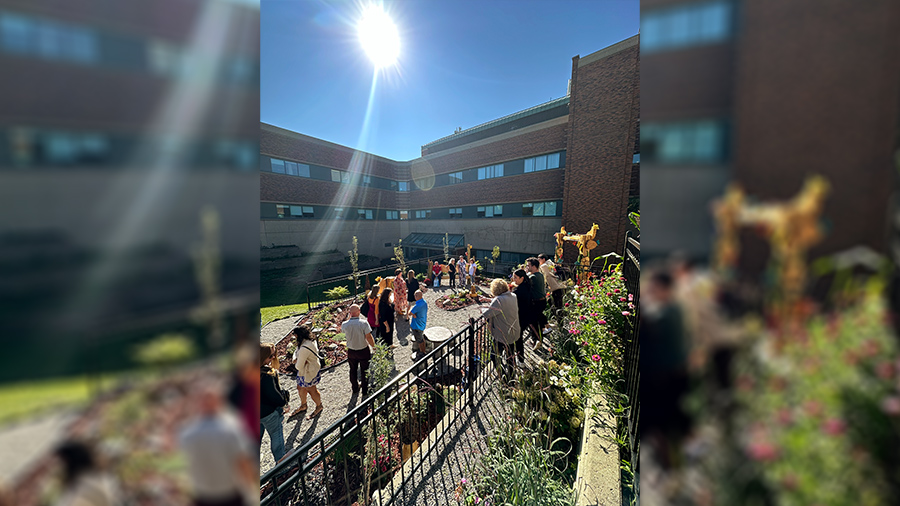 Staff, volunteers and visitors celebrate the official opening of a new healing garden at the Sturgeon Community Hospital, a project made possible thanks to community support and hospital staff volunteers.