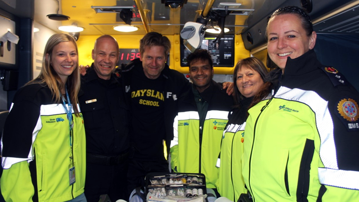 Stroke ambulance patient Steven Howrish, third from left, thanks staff members, from left, Kalene Hoefels, Keelly Brown, Dr. Ali Nomani, Marilyn Gibbons Doyle and Rae-Ann Hanson for their service. With its own CT scanner, this specialized ambulance is the only one in Canada that provides life-saving stroke interventions right in the field to boost recovery outcomes for patients.