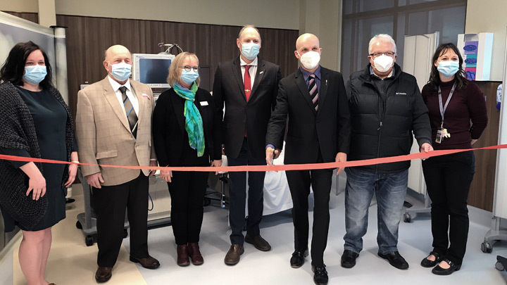 Cutting the ribbon to the new renal dialysis unit at High Prairie Health Complex are, from left: Janet Farney, site manager; Robert Nygaard, reeve, Big Lakes County; Cindy Harmata, senior operating officer, Areas 5-8 North Zone Allied Health and Seniors; Brian Panasiuk, mayor of High Prairie; Pat Rehn, MLA, Lesser Slave Lake; Barry Sharkawi, chamber president; and Kristin Dirom, unit manager, Alberta Kidney Care North.