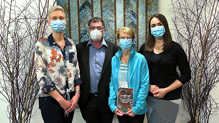 Dietitian Lindsay Lee, left, oncologist Dr. Michael Sawyer, patient Pat Spruyt and Dr. Carla Prado tout the benefits of more protein in the diet to preserve muscle mass during cancer treatment. A new publication, The High Protein Cookbook for Muscle Health During Cancer Treatment, offers tasty meal ideas to achieve this goal.