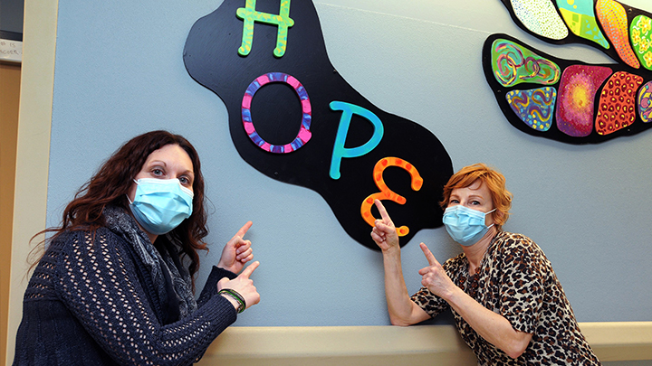 The Health Quality Council of Alberta has awarded a Patient Experience Award for Hope Hallway on the adolescent mental health units at Foothills Medical Centre. Patients, family, staff and community artists transformed the traditional, institutionalized feel of the hospital to one that is teen-friendly, hopeful, comforting and engaging. Here, committee member Jillian Paulsen, left, and volunteer artist Tracy Franks pose in the hallway.