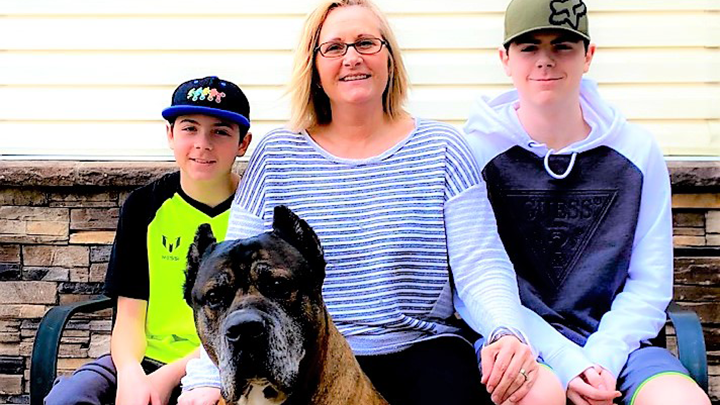 Jesse, 13, left and Jacob, 14, strike a pose with mom Andrea Stepanick and dog Zeus on their acreage west of Stony Plain. “I take time each day to talk to the boys, to see how they’re feeling and what they’re thinking,” says Andrea.