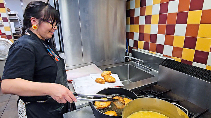 Here Peltier can be seen preparing bannock in the Cafe VA kitchen as part of the celebrations for last year’s National Indigenous Peoples’ Day.