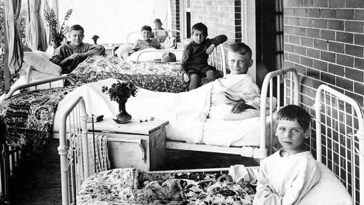 Boys catch some fresh air and sunshine on the veranda of the Junior Red Cross Children’s Hospital in Calgary a century ago.