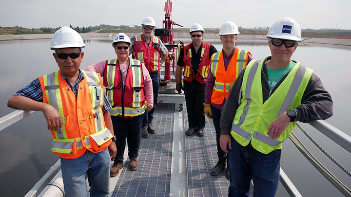 After years of blindness and having to step back from her beloved career as a construction engineer several times, Karyn Wog, second from left, is back to work as a project manager for water and wastewater infrastructure in Edmonton.