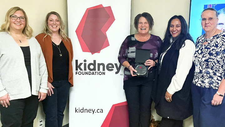 Tracy Zeiler, centre, receives her 2024 Karley Patient Services Award from The Kidney Foundation of Canada at a recent ceremony. With her, from left, are: Jill Goth, manager of Programs and Public Policy; Michelle Hofer, manager, Communications and Community Development with The Kidney Foundation; Parveen Sandi, manager, Alberta Kidney Care – South; and Jozefina Lily Scarrett, Patient Care manager, Alberta Kidney Care – South.