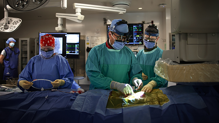 Dr. Derek Exner, centre, a cardiologist and associate dean at the University of Calgary, implants an Aveir leadless pacemaker in a patient at the Foothills Medical Centre. Health Canada recently approved the advanced device after a successful eight-year clinical trial.