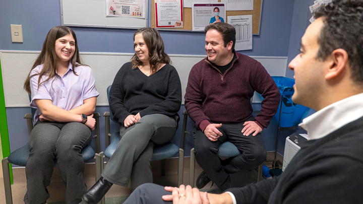 The Heathcote family —  Haley, left, with her parents Delta and Mike — enjoy a visit with their pediatric cardiologist Dr. Michael Khoury, who keeps an eye on their cholesterol levels. Haley and her brother Ryan (not shown) live with Familial Hypercholesterolemia (FH), a genetic disorder that increases the likelihood of having coronary heart disease or a heart attack at a young age.