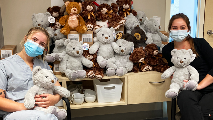 Reagan Broadhurst, left, and Skye Murk, friends and service workers, show off some of the bears they collected in support of the Bereavement Program at the Lois Hole Hospital for Women.