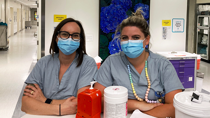 Registered Nurses Renee Booth, left, and Tatianna Zammit work on the labour and delivery unit at Edmonton’s Royal Alexandra Hospital’s (RAH) Lois Hole Hospital for Women. Their team stepped up earlier this year to support NWT patients who were faced with a new out-of-province delivery plan during the COVID-19 pandemic.