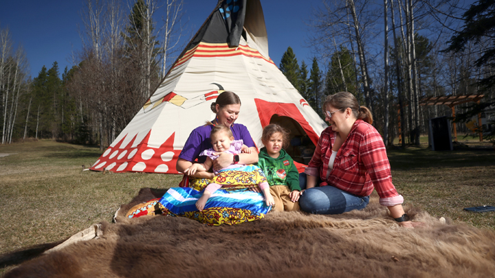 On a postpartum visit, Matheson checks in on Karlee Fellner and her two children. Fellner gave birth to her daughter in a tipi alongside Matheson—honoring the importance of respecting integrating cultural beliefs, values and practices into midwifery care.