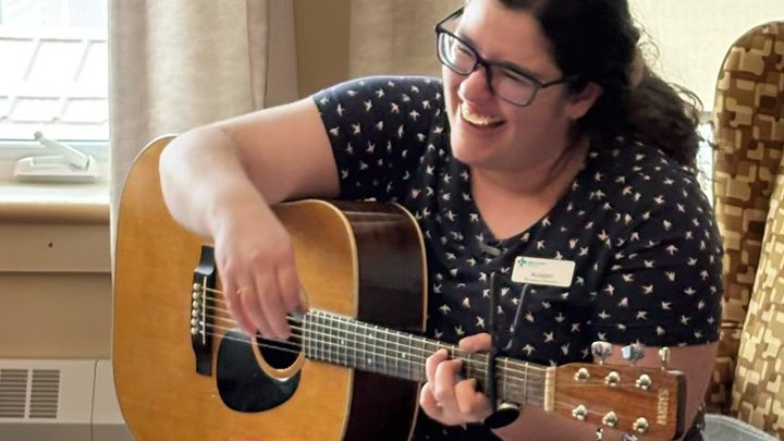 When she strums her guitar, Kristen Rejuso says some residents, who are typically quiet and reserved, are visibly moved and light up when they hear a familiar song.