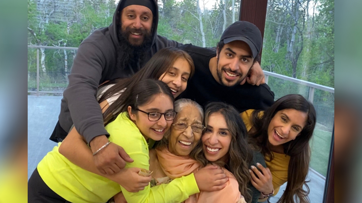 The Randhawa family are being recognized this year with a National Philanthropy Day Award from the Edmonton & Area Chapter of the Association of Fundraising Professionals. Alberta Cancer Foundation nominated the family to thank them for their fundraising efforts in memory of their late mother, Gurmeet Randhawa, seen smiling here in the front row, surrounded by her family’s love.