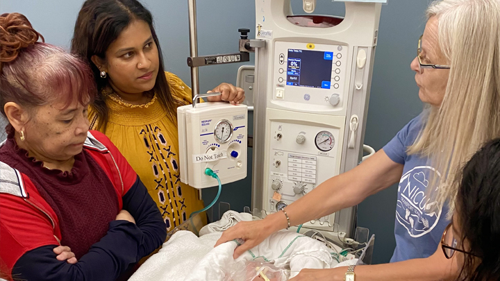 Heidi Haring, Neonatal Intensive Care Unit (NICU) Transport RN, provides hands-on education in premature infant care and thermoregulation during a neonatal training session.