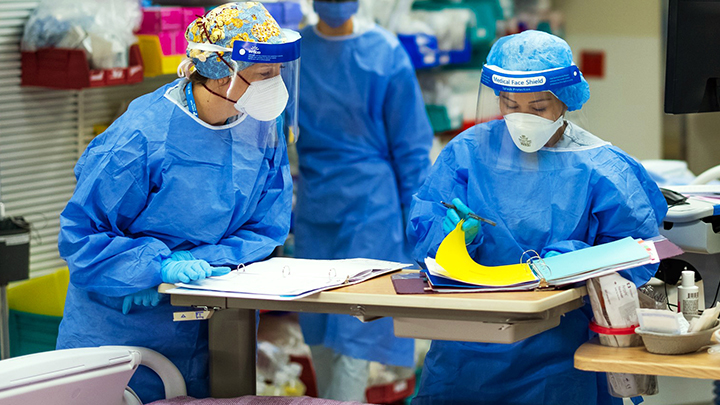 Jennifer Richard, left, a Registered Nurse from Newfoundland and Labrador, works alongside Camille Torres in the Northern Lights Regional Health Centre in Fort McMurray.