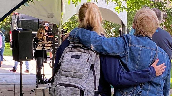 Family members share a hug in memory of loved ones lost to drug use at an Overdose Awareness Day event hosted by the AHS Safeworks team at Central Memorial Park in downtown Calgary.