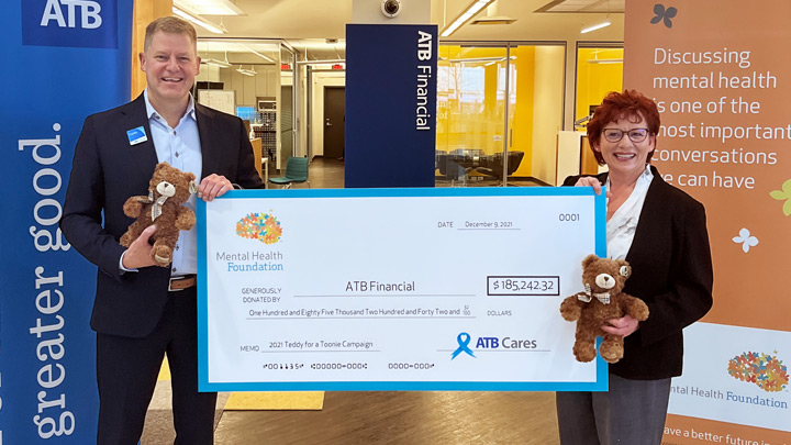 Curtis Stange, president & CEO of ATB Financial, and Deborah McKinnon, president & CEO of the Mental Health Foundation, strike a philanthropic pose with a huge cheque. This year, ATB Financial is being recognized with a National Philanthropy Day award from the Edmonton & Area Chapter of the Association of Fundraising Professionals. The Mental Health Foundation nominated ATB to thank them for their fundraising efforts toward youth mental health.