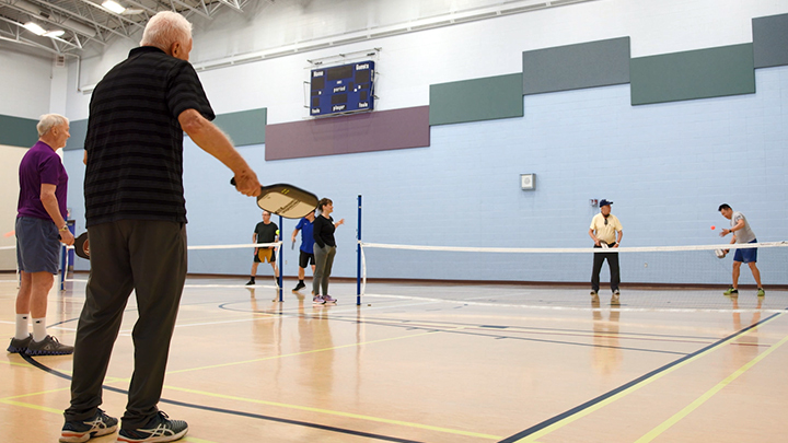 Newfound friends who met at the Glenrose Rehabilitation Hospital play pickleball to continue their long-term rehabilitation journey together at the Central Lions Recreation Centre in Edmonton.