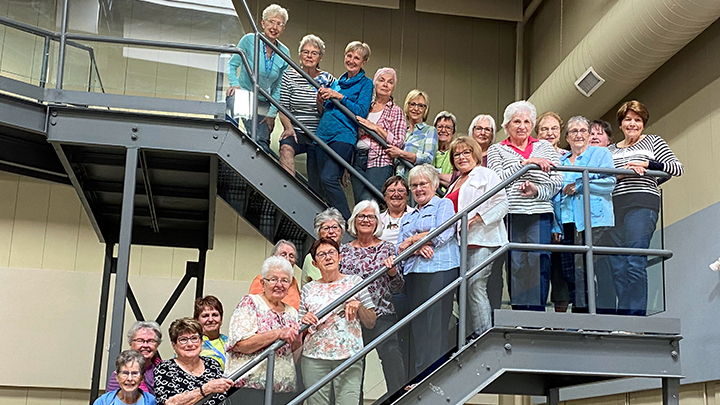 More members of the Ponoka Auxiliary step up for a stairwell group photo as they mark more than 70 years of service.
