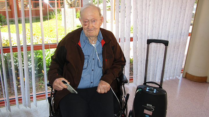 John Dahlseide, a resident at Cold Lake Long-Term Care Centre, enjoys using the new portable oxygen concentrator that was recently donated by the Cold Lake Healthcare Centre Auxiliary.