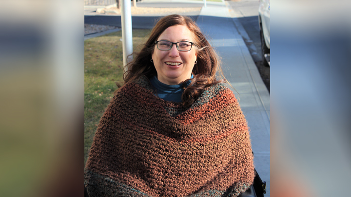 Nicola Birchall enjoys some sunshine and fresh air from the seat of her motorized wheelchair. Living with paralysis after a workplace accident many years ago, she keeps an eye on any signs of potentially life-threatening pressure injuries that she may not even feel.