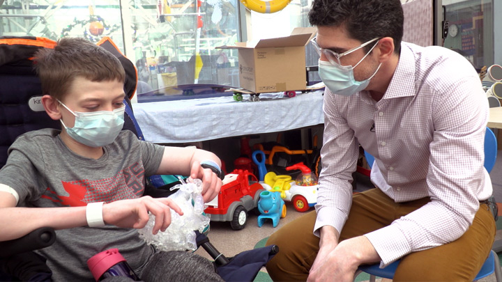 Brendan Ritchie and Dr. Charles Larson, a pediatric cardiac intensivist, check out a life-sized 3D model of Brendan’s heart.