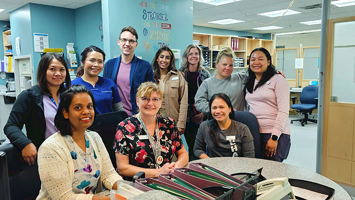 “It takes a village to plan an effective discharge!” say team members at Red Deer Regional Hospital Centre. Shown are, front row from left: RN Vineeta Mullapudi, head nurse Tammy Anderson and physiotherapist Christine Caballero. In rear, from left, are: unit clerk Ruth Jacobs, RN Janica Bacuentes, quality consultant Nathan Maskowits, acute care manager Ruby Ubhi, LPN Sandy Anderson, therapy assistant Lauren Goodman and RN Glynnis De Guzman.