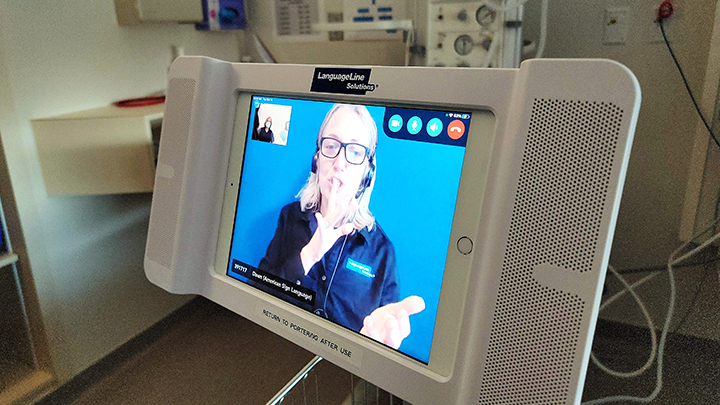 Here an interpreter provides translation in American Sign Language.