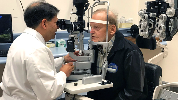 Dr. Karim Damji checks Donald Bourque’s vision. A routine eye exam helped Bourque discover he had glaucoma. In 2017, he received a combined cataract and glaucoma surgery to enhance his vision. Glaucoma affects one to two per cent of the population, with many unaware they even have it until vision loss is advanced.