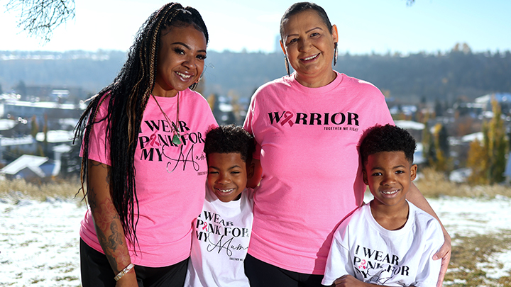 Renee Johnson, her daughter Alandra, and seven-year-old grandsons Tyson and Benjamin pose for a portrait after her final radiation treatment for breast cancer on Oct. 22.
