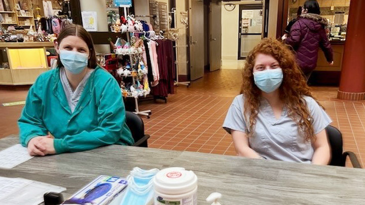 Leanne Loken, left, and Jenna Medhurst welcome all to Medicine Hat Regional Hospital. Some visitors have brought gift cards and tokens of appreciation to screeners.