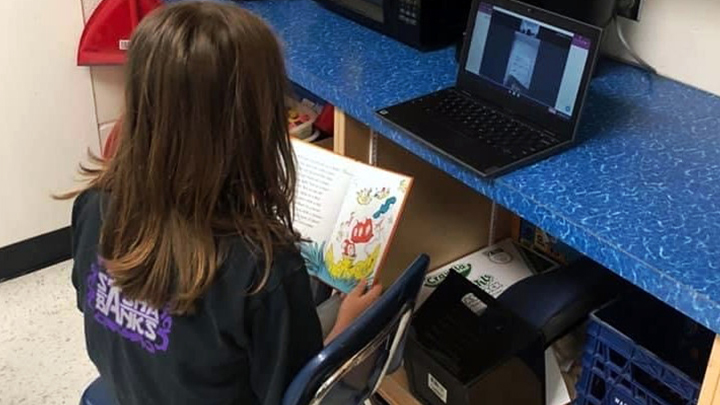 A student of E.G. Wahlstrom School in Slave lake reads virtually to a patient at Slave Lake Healthcare Centre as part of a special literacy partnership between the school and AHS.