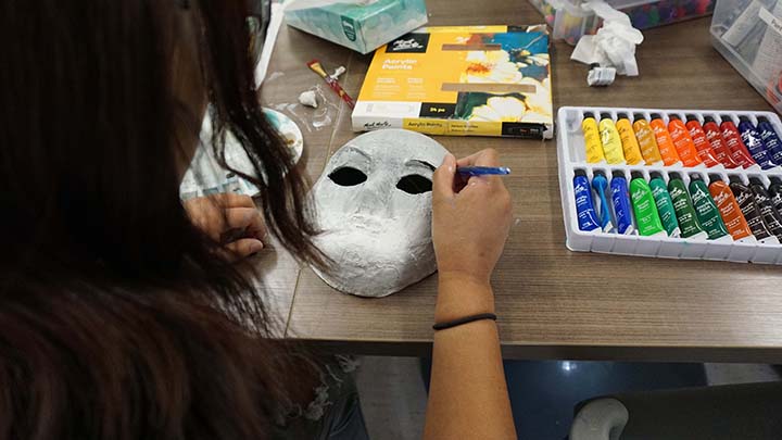 One of the live-in youth clients is shown here taking part in an art project about their identity.