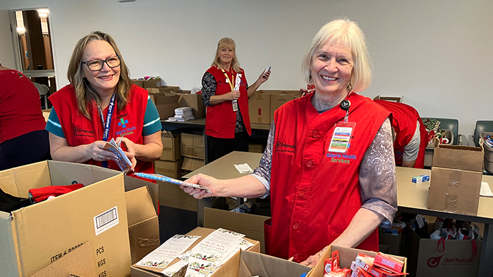 Shirley Wilkinson, left, Laurie Colussi and Ruth Gronemeyer stuff stockings for patients at Chinook Regional Hospital in Lethbridge.