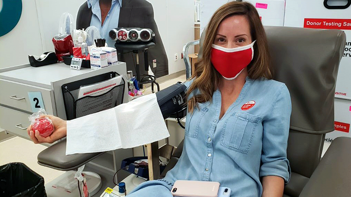 Stollery nurse Dena Chuckrey dons a face mask to donate blood for the first time. Chuckrey organized a group donation with her nursing colleagues in response to the blood shortage during the COVID-19 pandemic. Blood and blood products are integral to patients involved in major surgeries, medical procedures, cancer treatments and managing diseases and disorders.