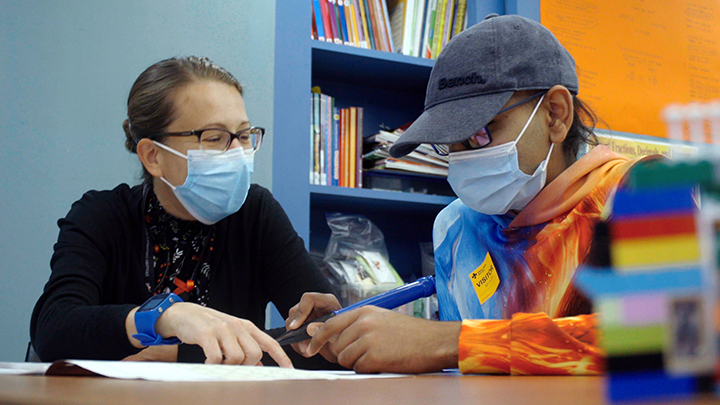 Teacher Heidi Hughes, left, works with her student Hari Sekar, 16. “For a child, being a student is their job description,” says Hughes, department head at the Stollery Children’s Hospital School. “So when a child is in hospital, going through a difficult time, it provides that stability, that normalcy, for them to continue what they are meant to do, which is to learn.”