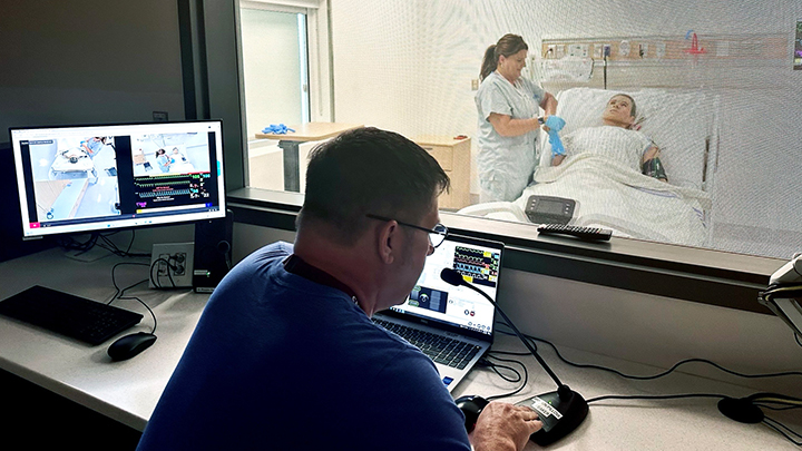 Ken Brisbin, Simulation Lead - Planning, eSIM, AHS sets up a healthcare scenario in the Sturgeon Community Hospital’s new simulation centre. In the new dedicated space, clinical events are recreated to engage clinical teams through an interactive, immersive and meaningful real-world experience.