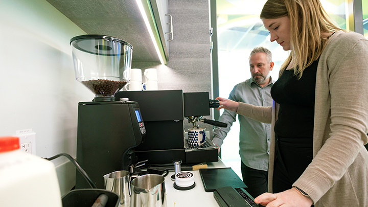 Phil & Sebastion’s Rob Oppenheim with AHS occupational therapist Katelyn McNeil at The Summit’s 'barista station'.