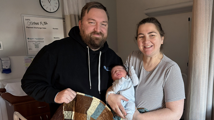 Tyler and Kathryn Loewen recently welcomed their first baby at Chinook Regional Hospital. The comfort cart delivered this beautiful handmade quilt along with a sunshine card. The new family were thrilled to pose for their first family portrait.